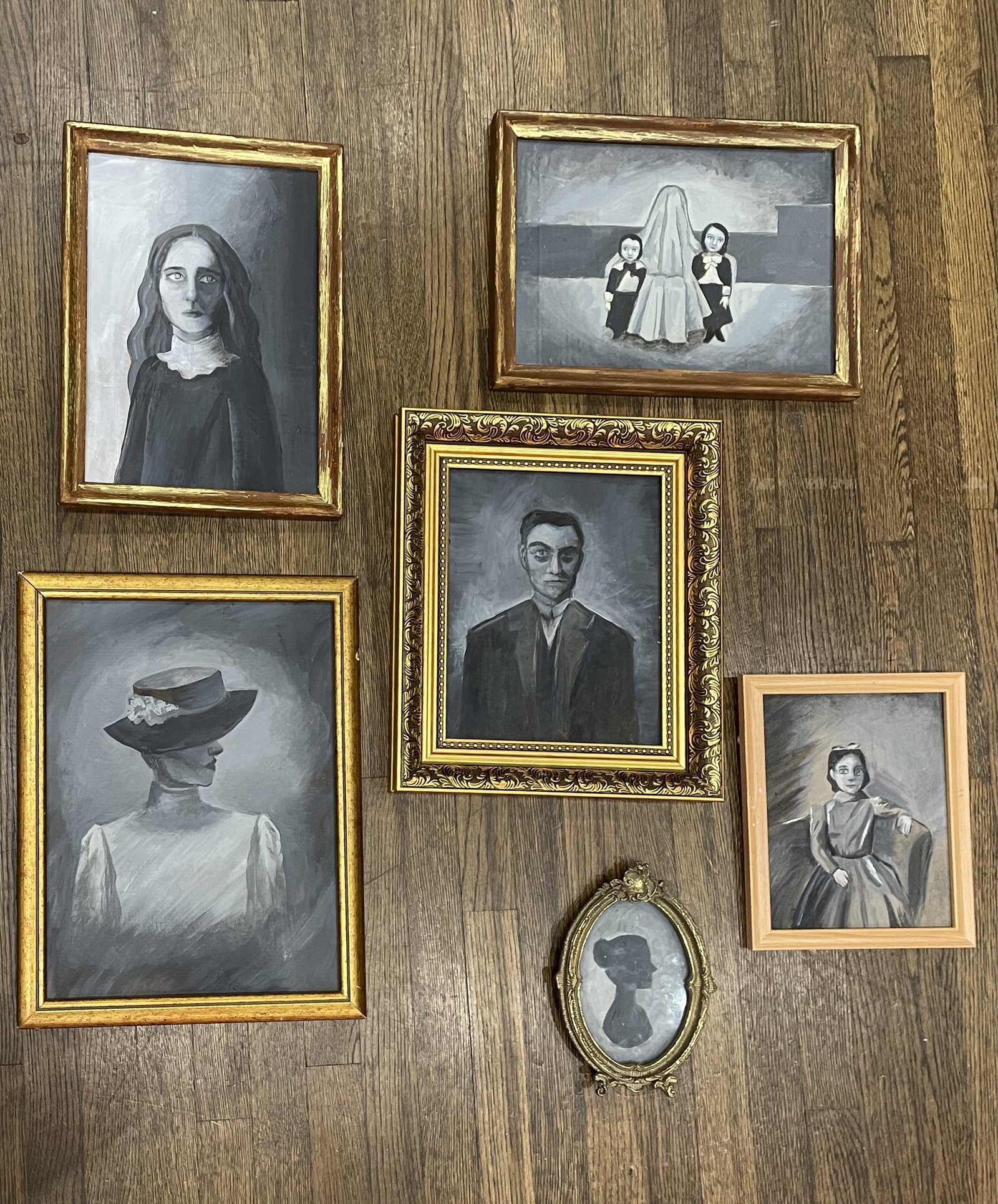 Portraits I painted of each of the house's deceased family members